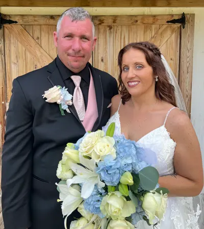 A bride and groom with her bouquet on their wedding day