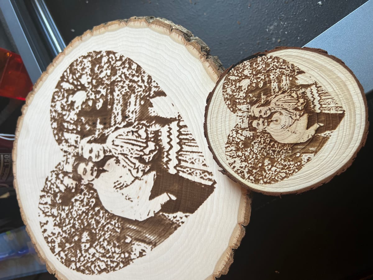 Wooden rounds with a couple’s photograph laser-engraved into the grain, made to display at home